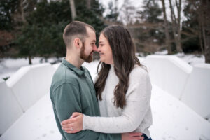 DOW Gardens engagement photos in front of the stone bridge